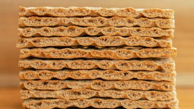 Close-up of stacked whole grain crispbread, perfect for healthy snacks and diet plans.