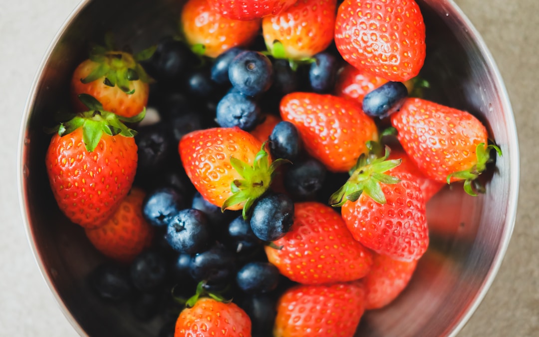 A bowl of fresh strawberries and blueberries