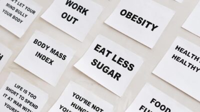 Collection of motivational notes promoting health and wellness found on paper notes.