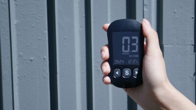 a person holding a cell phone in their hand