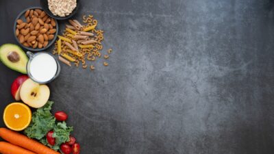 a black table topped with fruits and vegetables