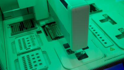 white and teal printer on white desk