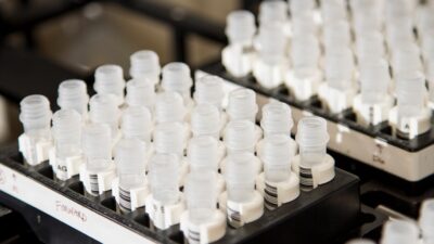white plastic bottles on black shelf