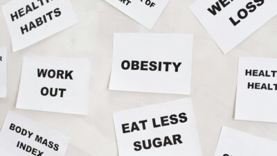 Conceptual image featuring motivational cards on health, fitness, and wellness on a white background.