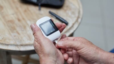 a person testing blood sugar