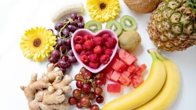 yellow banana fruit and red fruits