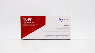 Close-up of a medicine package with Georgian text on white background.