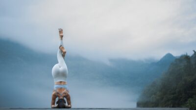 A person doing a handstand on a road