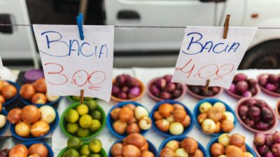 Colorful assortment of fruits and vegetables on display at a vibrant market stall.
