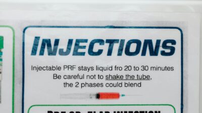 Detailed view of a medical card with injection instructions and cautionary text.