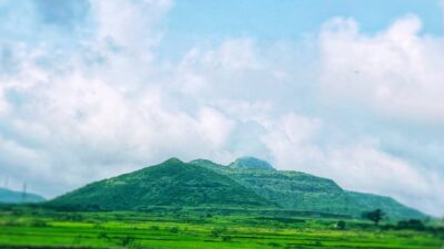 Green mountain and a cloudy sky.