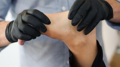 person massaging other person's foot