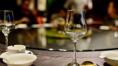 a table topped with plates and glasses of wine