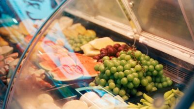 Fresh grapes and watermelon in display case