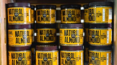 pile of Natural Almond bottles