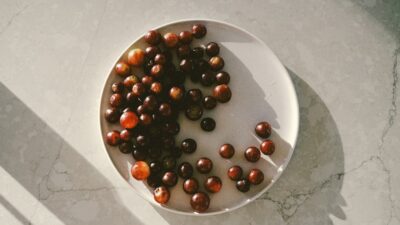 a white bowl filled with nuts on top of a table