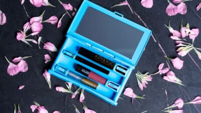 blue and black tablet computer on white and purple floral textile
