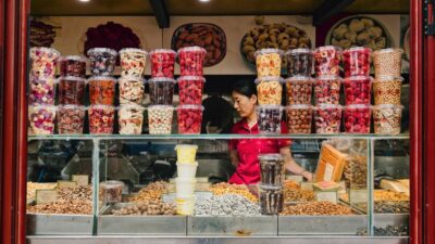 Vendor selling dried fruits and nuts from stall