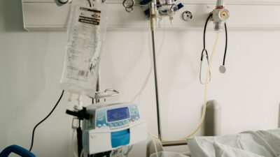 a hospital room with a bed and medical equipment