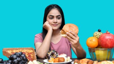 a woman eating a sandwich