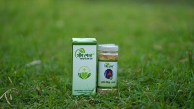 Herbal medicine bottle and box on grass