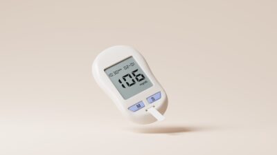 a digital thermometer on a beige background
