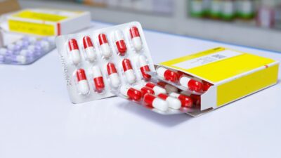 white and red medication pill blister pack
