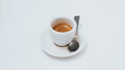 white ceramic teacup on saucer