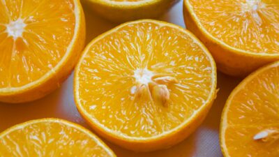 Close-up of juicy orange slices showcasing vibrant pulp and texture, ideal for nutrition and health visuals.