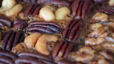 Close-up of assorted nuts baked into a dessert.