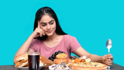 a woman eating a plate of food