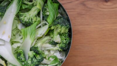 green vegetable on brown wooden table