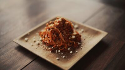 spaghetti served on brown plate