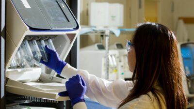 woman holding test tubes