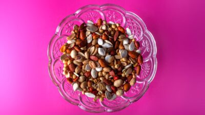 brown and white beans in clear glass bowl